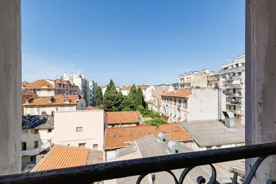 a view of a city from a balcony at Duplex à 2 min de la mer à pied in Nice