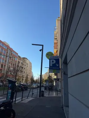 a street sign on a sidewalk next to a building at La Casa di Gio studio Cosy Tram et mer in Nice