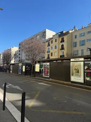 an empty street in a city with buildings at La Casa di Gio studio Cosy Tram et mer in Nice