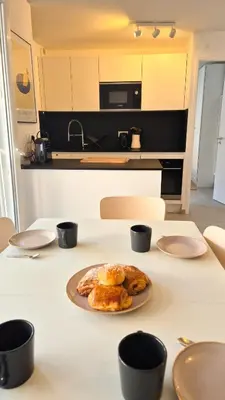 a plate of food on a table in a kitchen at T3 neuf climatisé avec parking à Nice in Nice