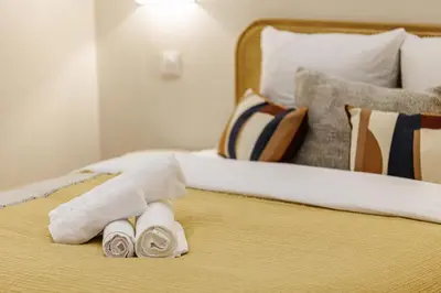 a bed with two rolled up towels on it at 62 CARNOT LOT 5 - Appartement renove - climatise 2 chambres suites in Nice