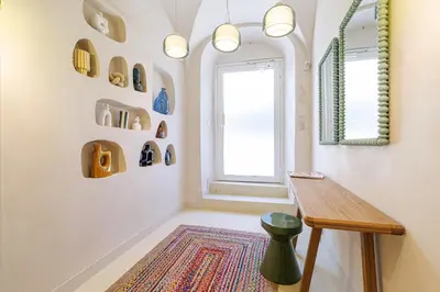 a room with a wooden table and a window at 62 CARNOT LOT 5 - Appartement renove - climatise 2 chambres suites in Nice