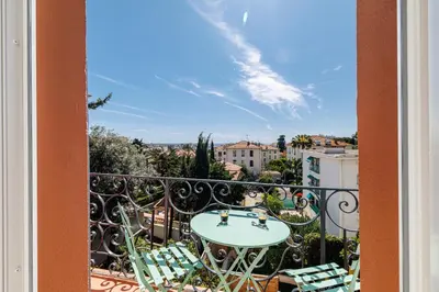 a view from a balcony with a table and chairs at 62 CARNOT LOT 7 - Appartement Duplex Atypique- climatise - 2 chambres in Nice