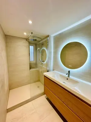 a bathroom with a sink and a shower at Appartement neuf d architecte Carré d Or in Nice