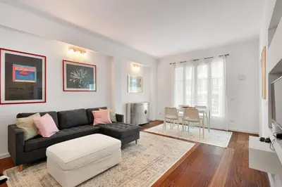 a living room with a couch and a table at Suite Lycka FSHH in Nice