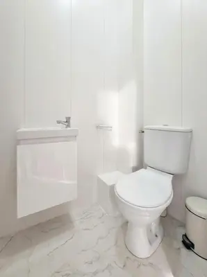 a white bathroom with a toilet and a tub at Blanche - From Nice with love in Nice