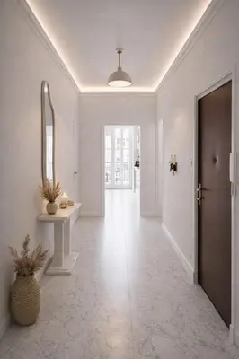 a hallway with a door and a table and a mirror at Blanche - From Nice with love in Nice