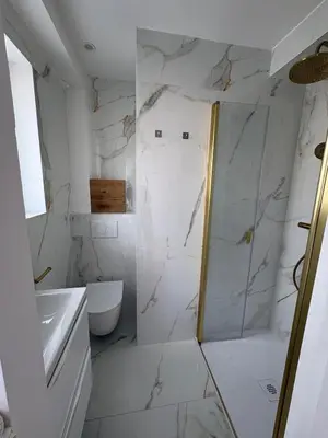 a bathroom with a shower and a toilet at Appartement T3 NICE Promenade des Anglais in Nice