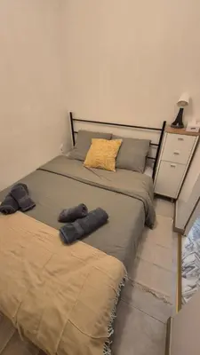 a bedroom with a bed with two towels on it at Cosy 1 Bedroom, balcony, Promenade des Anglais in Nice