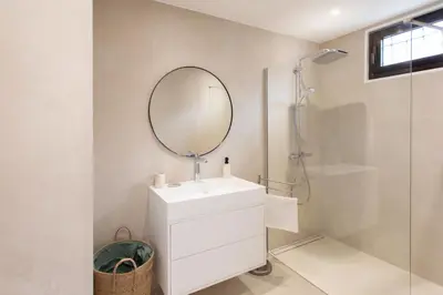 a bathroom with a sink and a mirror at Satywizus #22- Duplex panoramic sea view 2Bdr, AC, swimpool, parking, petanque in Nice