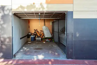 a garage with a bike parked inside of it at Satywizus #22- Duplex panoramic sea view 2Bdr, AC, swimpool, parking, petanque in Nice