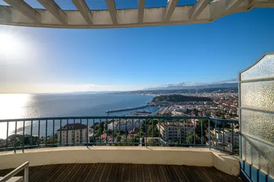 a balcony with a view of the water at Vue exceptionnelle in Nice