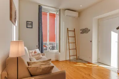 a bedroom with a bed and a window at VILLA BELLA VISTA BAY VI4488 By Riviera Holiday Homes in Villefranche-sur-Mer