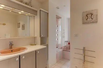 a bathroom with a sink and a bath tub at VILLA BELLA VISTA BAY VI4488 By Riviera Holiday Homes in Villefranche-sur-Mer