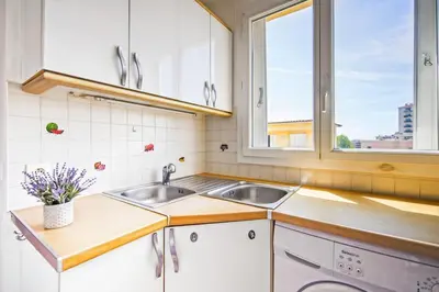 a kitchen with a sink and a window at Espace Anahit 2 piece meublé avec balcon, proche Tram Magnan et plages BAIL MOBILITE in Nice