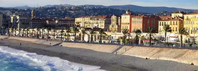 a view of a beach with buildings and the ocean at Sunny Old Town Studio in Nice