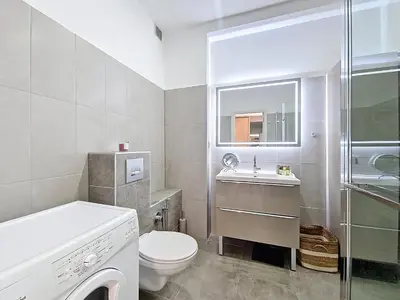 a white bathroom with a toilet and a sink at Nestor&Jeeves - BLUE PASTEL PROMENADE - Spacious - Close sea in Nice