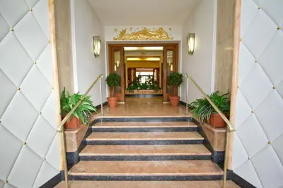 a staircase in a building with potted plants at Panoramic Sea front Cote d Azur in Nice