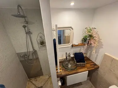 a bathroom with a sink and a shower at Auberge de la Croix du Pape in Èze