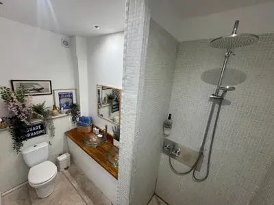 a bathroom with a shower with a toilet and a sink at Auberge de la Croix du Pape in Èze