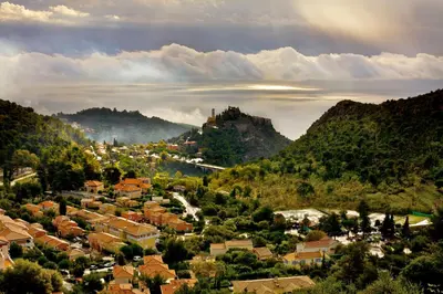 a small town in a valley with mountains at Auberge de la Croix du Pape in Èze