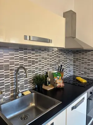 a kitchen with a sink and a counter top at Le Saint François - Au cœur du Vieux Nice in Nice