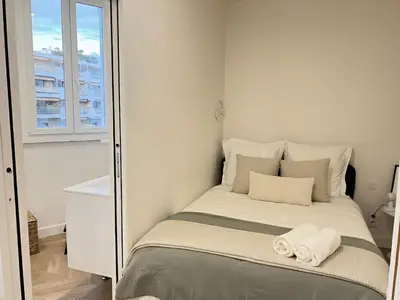 a bedroom with a bed with two towels on it at appartement moderne pour 3 pers Hyper Centre proche Jean Médecin in Nice
