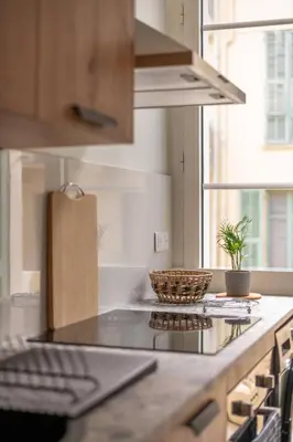 a kitchen with a counter with a bowl on it at Magnifique - 2 chambres - Cœur de Nice avec Balcon in Nice