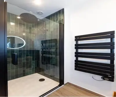 a bathroom with a shower with a glass door at Élégance & confort au cœur du Vieux Nice in Nice