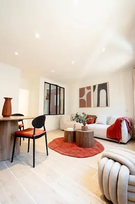 a living room with a couch and a table at Splendide Appartement Rénové Au Cœur du Vieux Nice in Nice