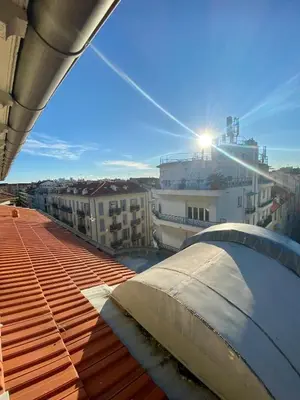 a view from the roof of a building with the sun shining at Studio moderne au Carré d'Or in Nice