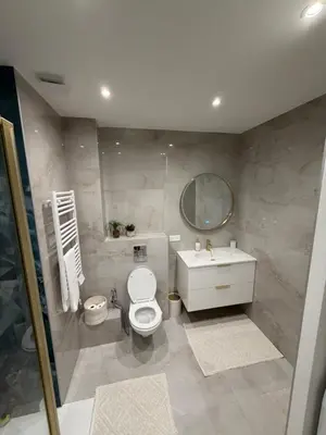a bathroom with a toilet and a sink and a mirror at Nice - 6 personnes - 3 lits - 3 pièces - Parking ! in Nice