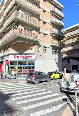 a parking lot with cars parked in front of a building at Nice - 6 personnes - 3 lits - 3 pièces - Parking ! in Nice