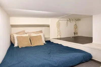 a bedroom with a bed with a blue blanket at DeLuxe Studio Cosy, Promenade des Anglais, NICE CENTRE in Nice