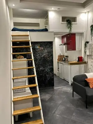 a loft bed in a room with a kitchen at DeLuxe Studio Cosy, Promenade des Anglais, NICE CENTRE in Nice