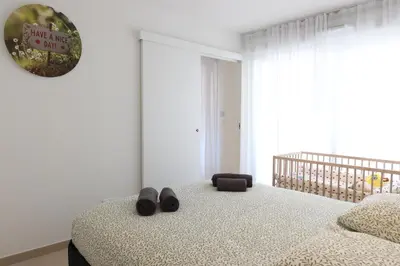 a living room with a blue couch and a table at Nice Time - Chic Apartment with sunny terrace, Nice Port in Nice