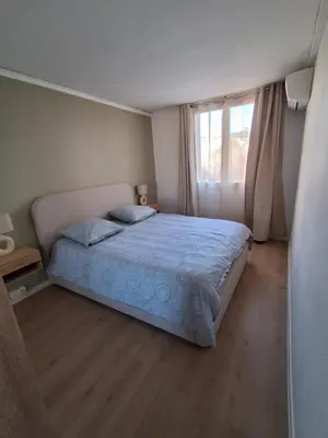 a bedroom with a bed and a window at Appartement 4 couchages Nice in Nice
