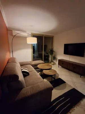 a living room with a couch and a flat screen tv at Appartement 4 couchages Nice in Nice
