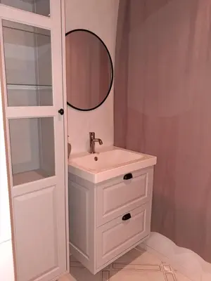 a white bathroom with a sink and a mirror at Appartement 4 couchages Nice in Nice