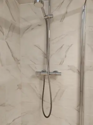 a shower with a shower head in a bathroom at superbe chambre plein centre Nice climatisé direct aéroport via tram in Nice