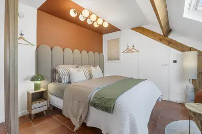 a bedroom with a large bed in a room at Studio sous les toits, Nice Centre in Nice