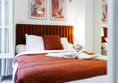 a bedroom with a bed with towels on it at Le Bijou de Grimaldi Emplacement de Rêve Plage in Nice