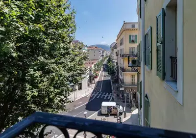 a view of a city street from a balcony at Le Bijou de Grimaldi Emplacement de Rêve Plage in Nice