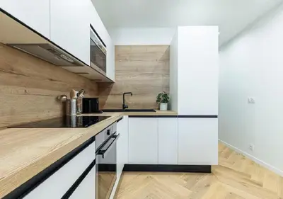 a kitchen with white cabinets and a sink at Carre dOr Design Confort and Centralité in Nice