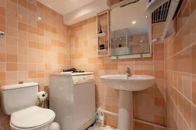 a small bathroom with a toilet and a sink at Le Riviera France in Nice