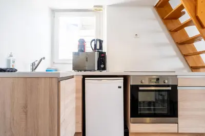 a kitchen with a sink and a dishwasher at Le Riviera France in Nice
