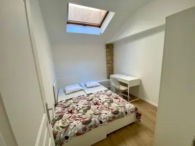 a small bedroom with a bed and a window at T4 Nice Centre - Close to shops, Wi-Fi, AC in Nice