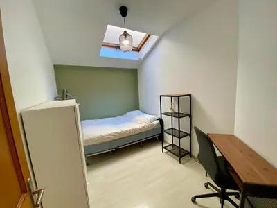 a small room with a bed and a desk at T4 Nice Centre - Close to shops, Wi-Fi, AC in Nice