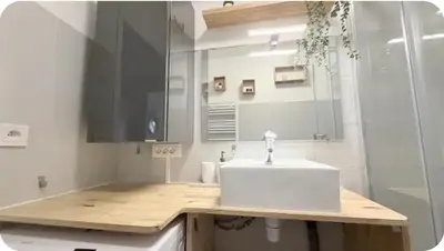 a bathroom with a white sink and a shower at Studio Vue Mer Nice in Nice