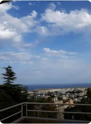 a view of a city with the ocean in the background at Studio Vue Mer Nice in Nice